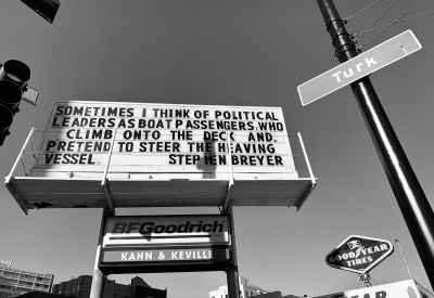 Sign at previous 555 Larkin site that states "Sometimes I think of political leaders as boat passengers who clim onto the deck and pretend to steer the heaving vessel. - Stephen Breyer"