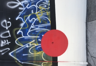 Painted red circle on the wall of David Baker Architects office in Oakland, California.