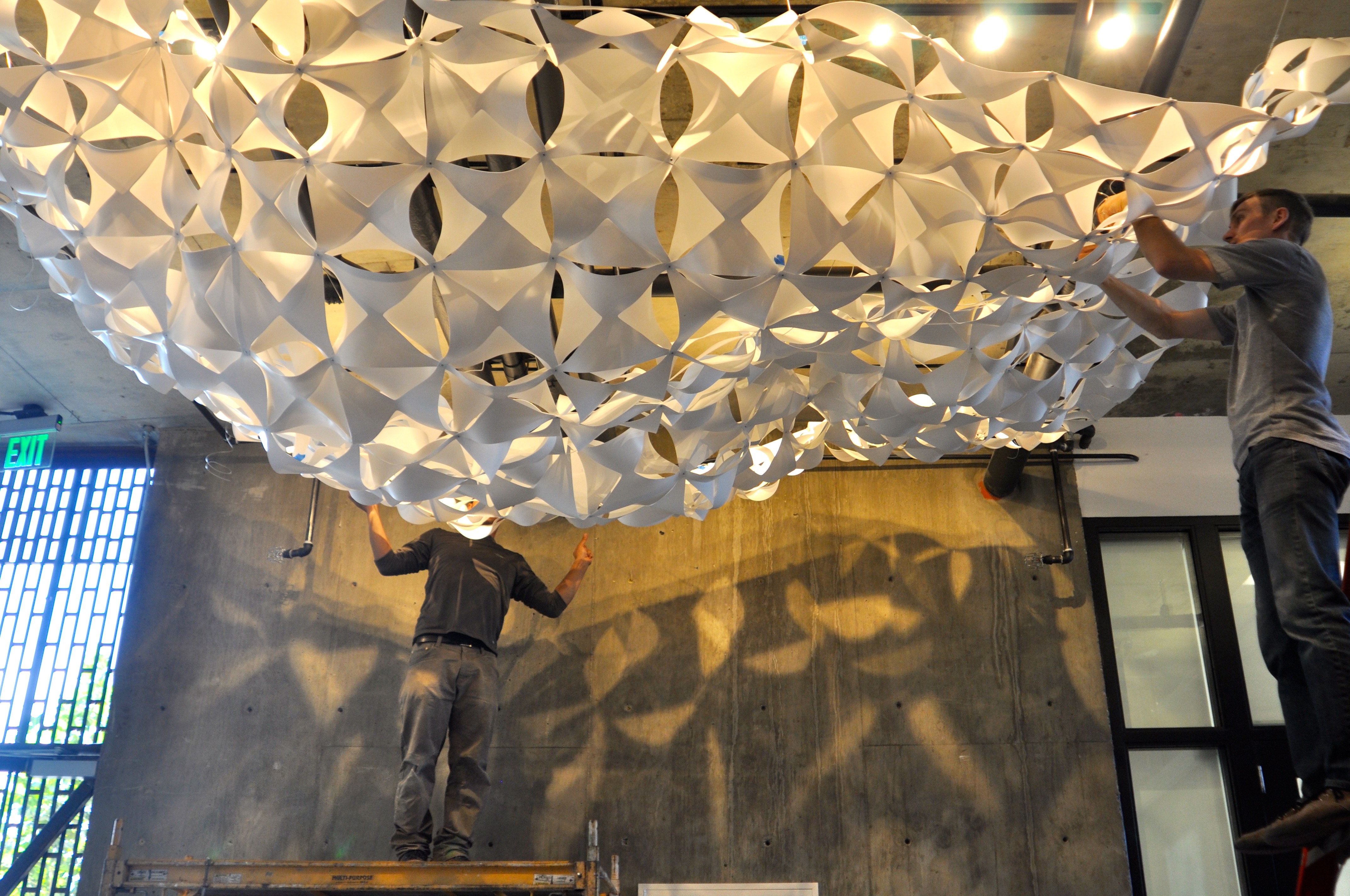 Installing of the cloud structure in the lobby of Rivermark in Sacramento, Ca.