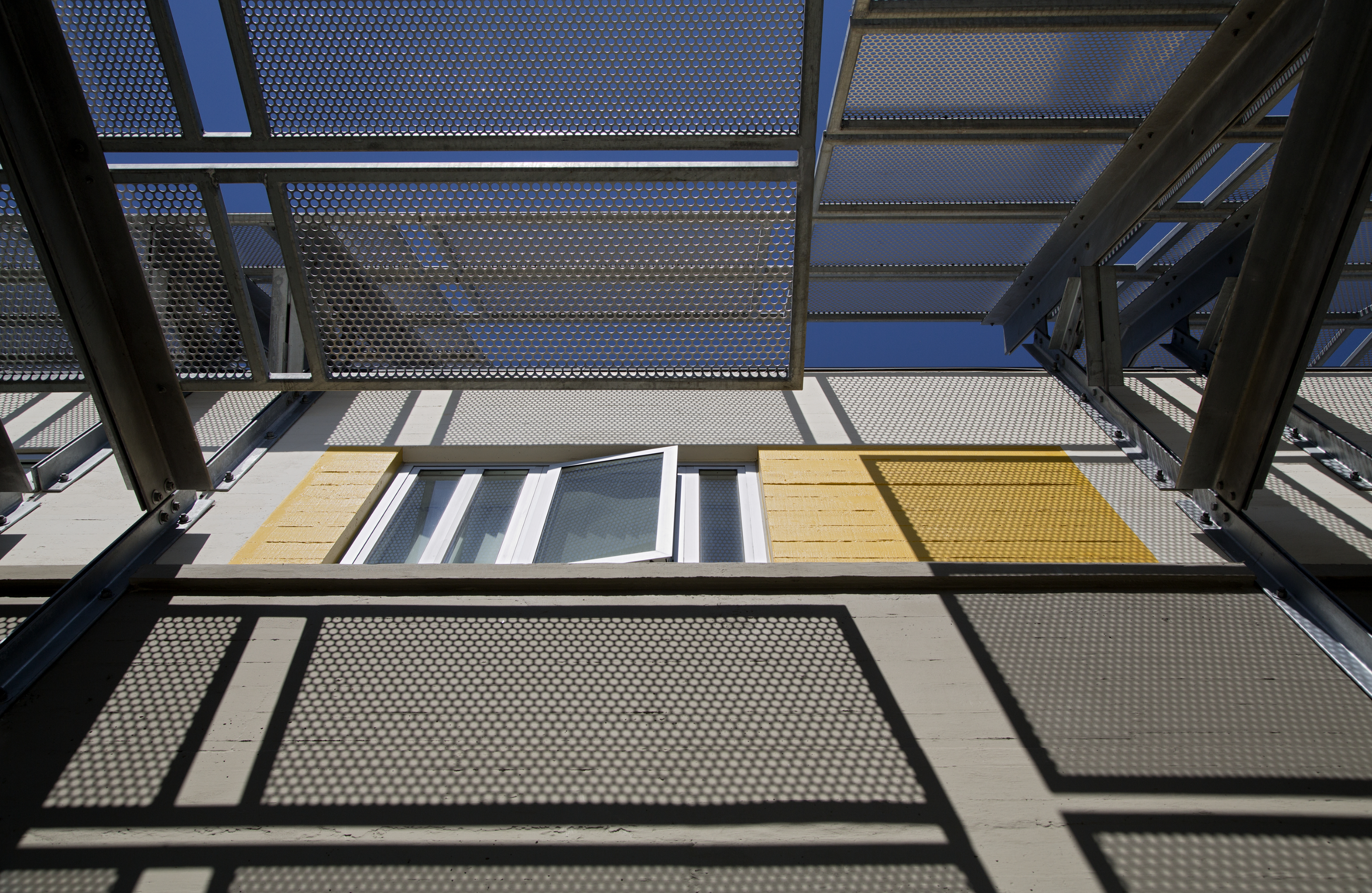 Looking up at the supportive housing units at Tassafaronga Village in East Oakland, CA. 