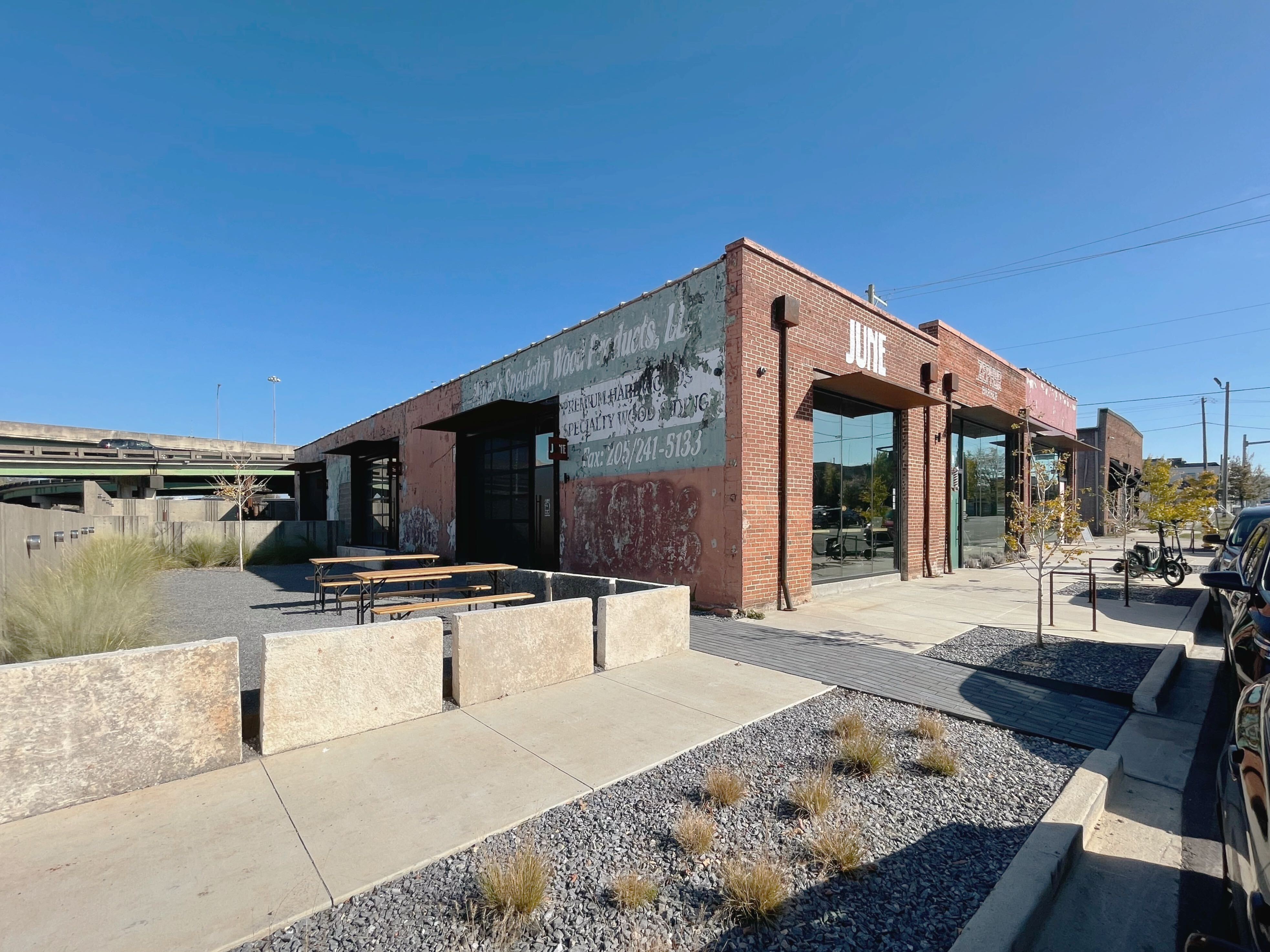 Exterior of Bandsaw Building, a renovated historic brick warehouse with five new commercial spaces.