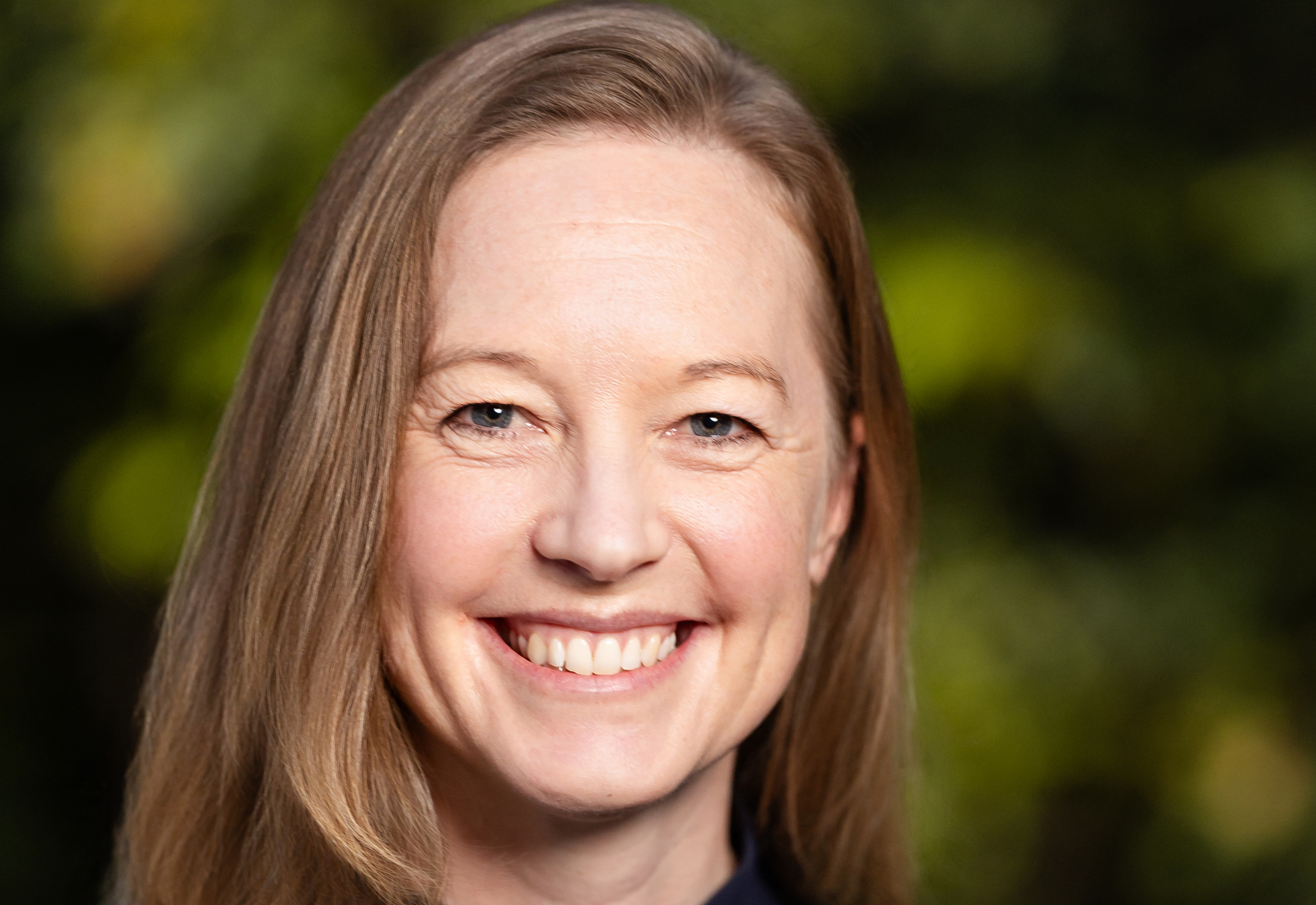 Headshot of woman with straight blond hair