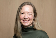 portrait of a smiling white woman with straight blonde hair