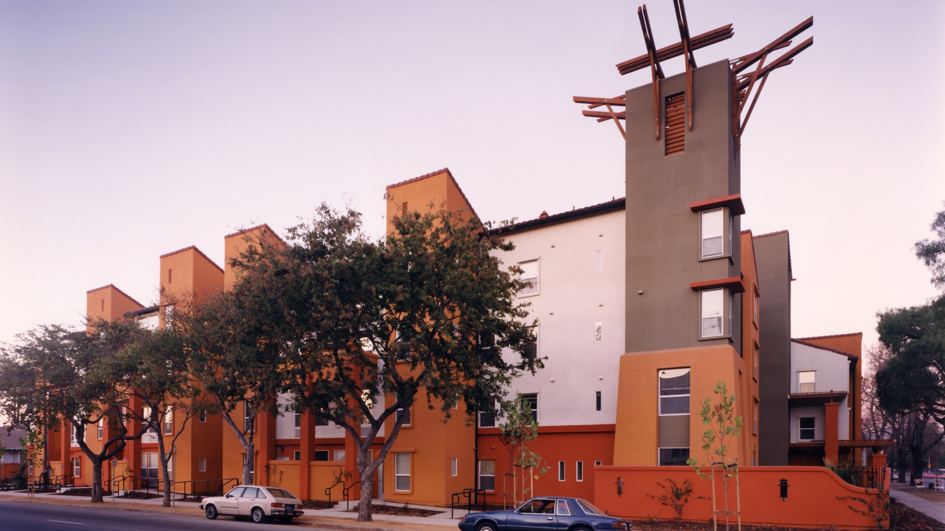 Exterior street view of Plaza Maria at sunset in San Jose, California.