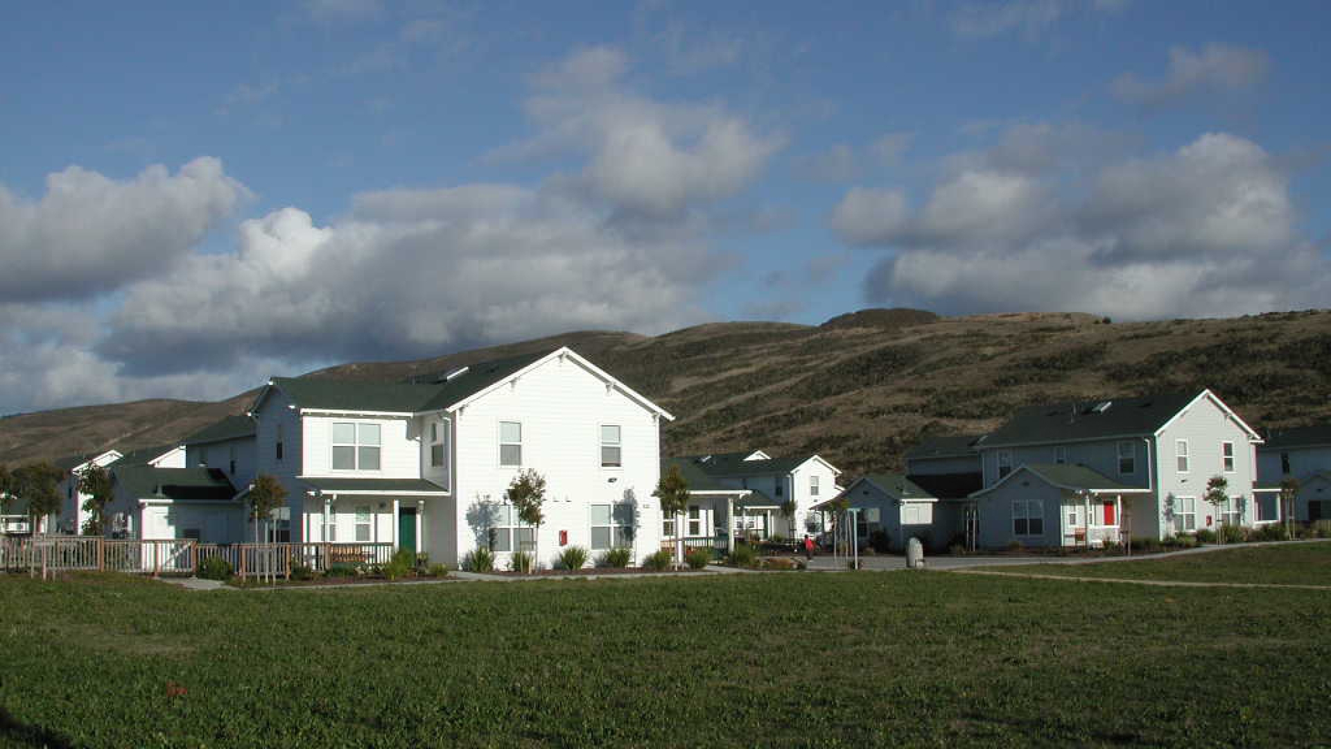 View of the grass area with Moonridge Village in Santa Cruz, California in the background.