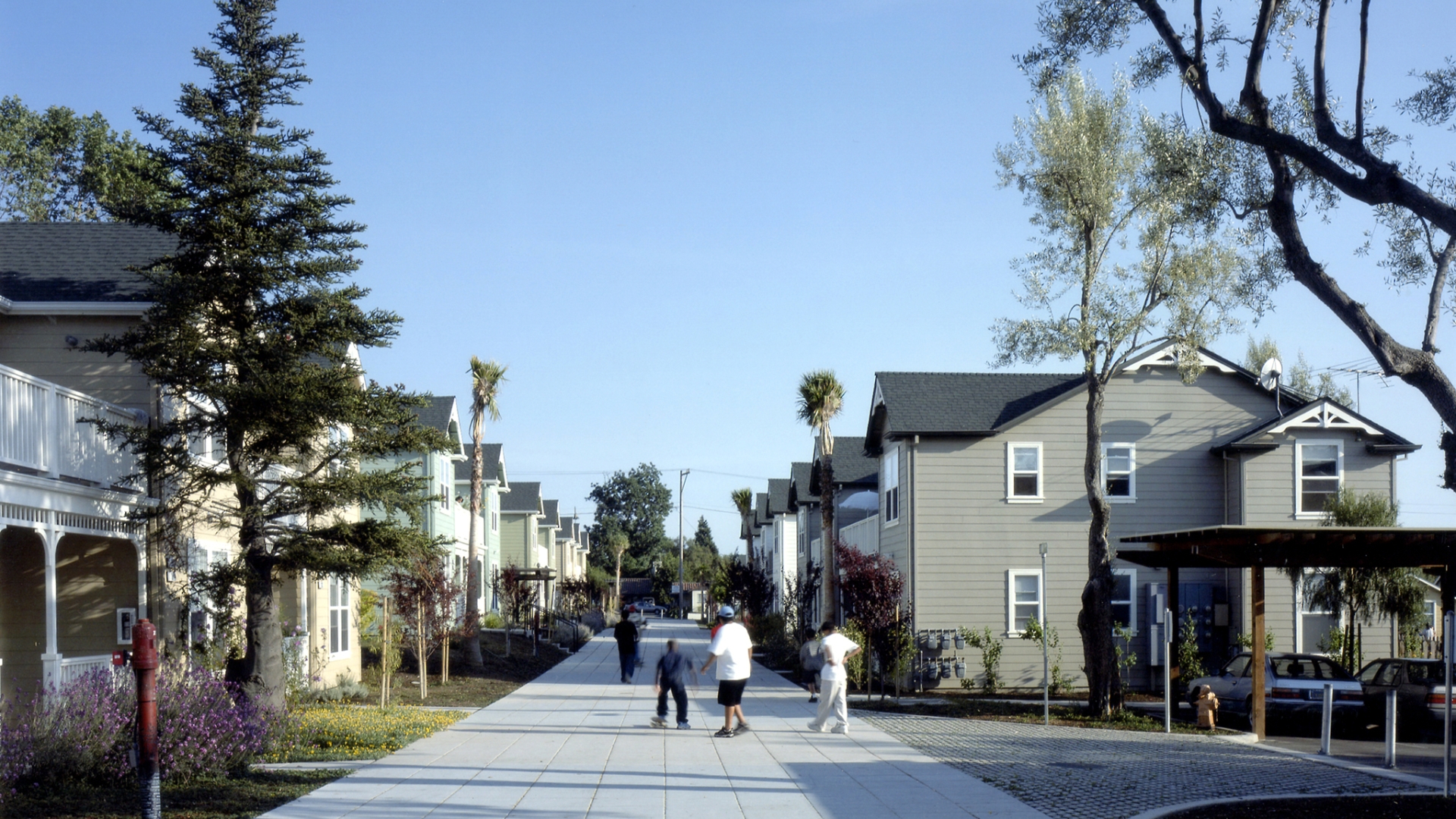 People walking down the pedestrian path at Oroysom Village in Fremont, California.