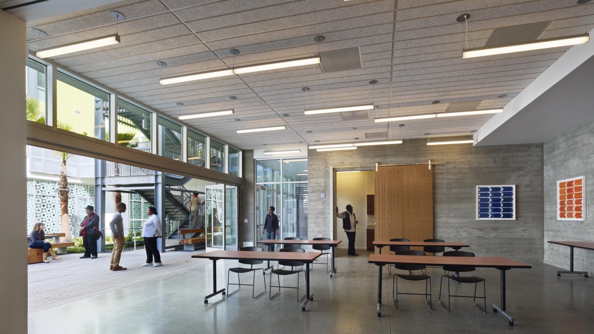 Community room looking out to the courtyard at Richardson Apartments in San Francisco.