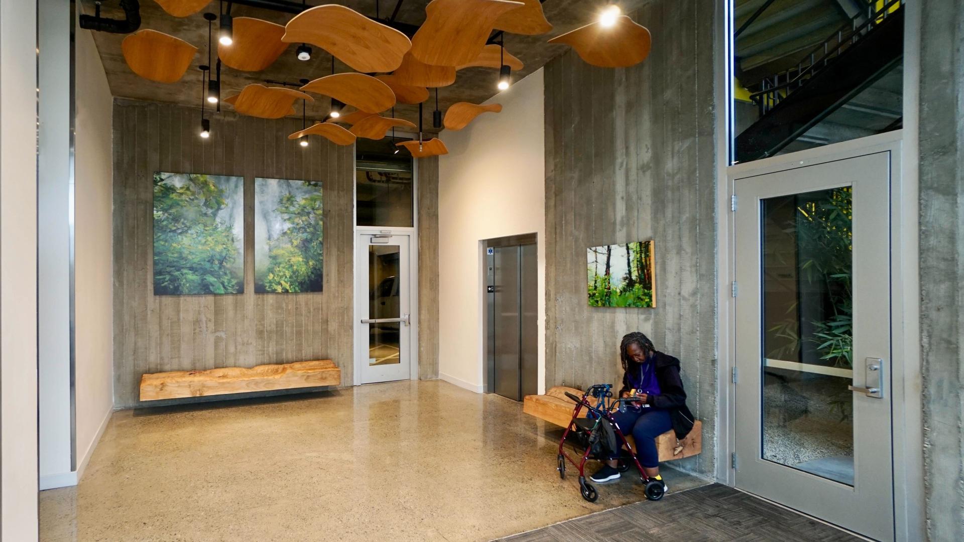 Custom sculpture and bench by DBA Workshop inside Coliseum Place, affordable housing in Oakland, Ca