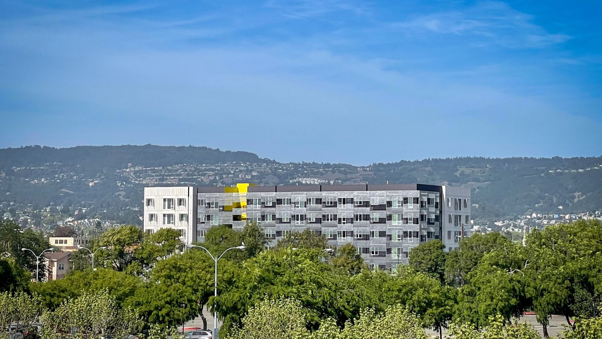 Exterior view of Coliseum Place from a distance in Oakland, California.