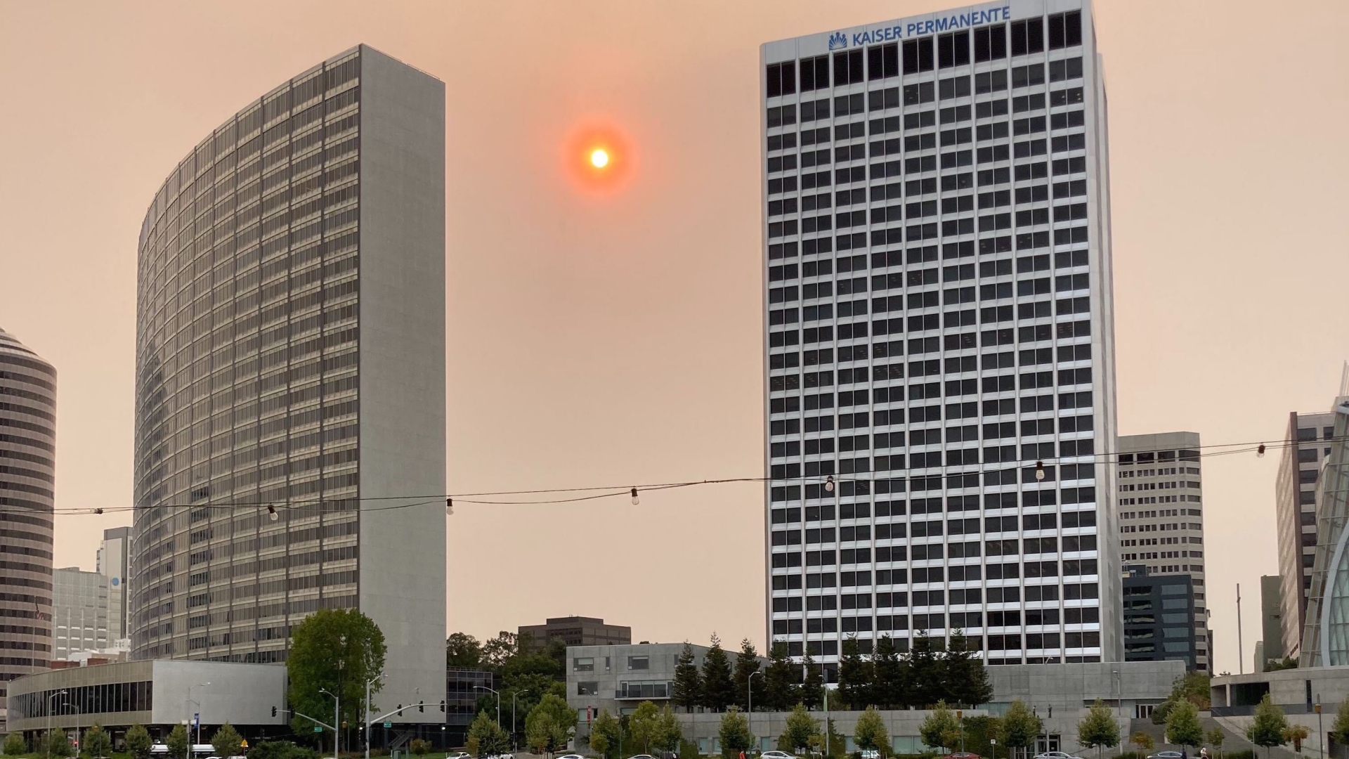 Orange haze in the sky at Lake Merit in Oakland after fires.