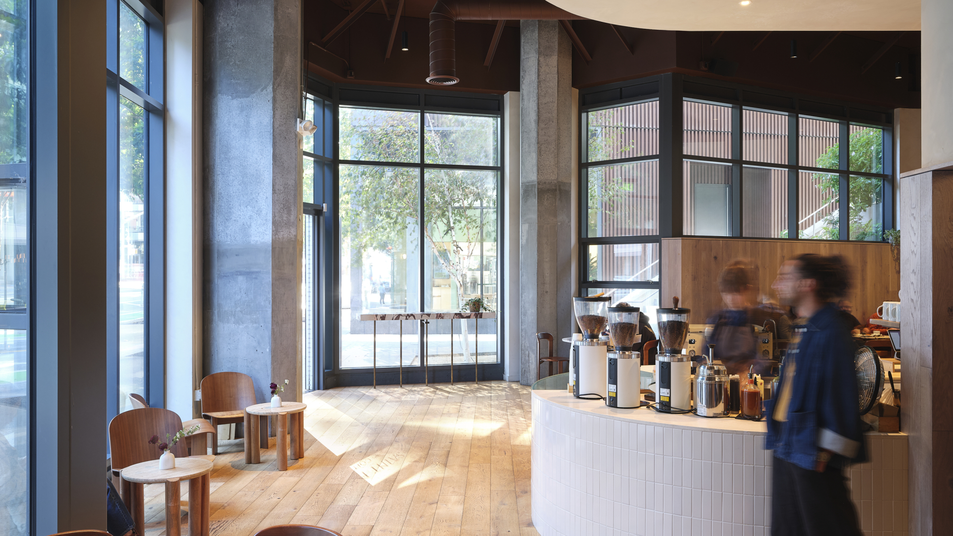 Overall interior shows order station and seating plys floor to ceiling windows