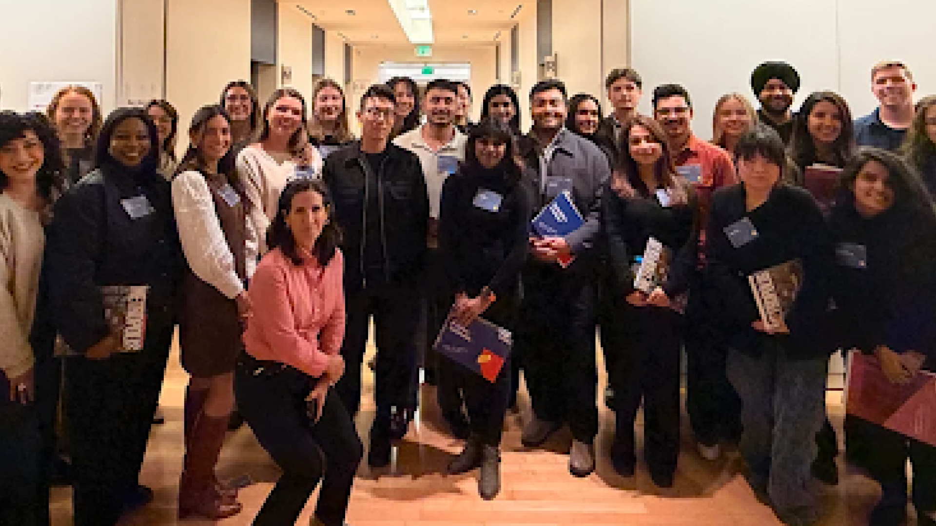 Large group of young architects photographed in an office setting