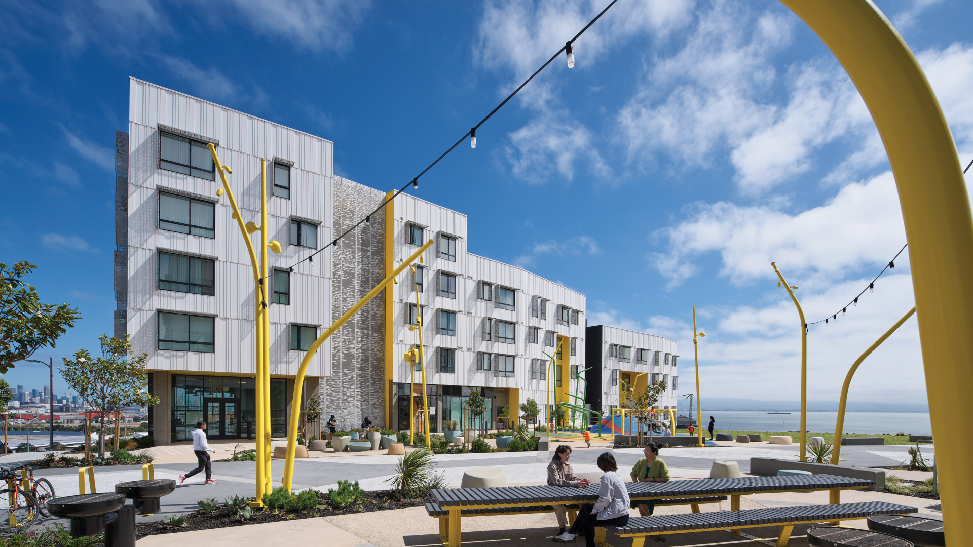 A view of the patios, public park and playground connecting the two buildings at Hunters View Phase III.