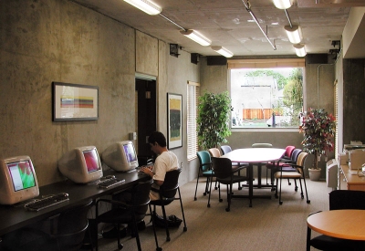 Resident using a computer at the community computer room Lenzen Square in San Jose, California.