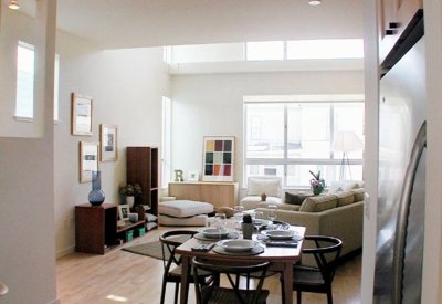 Kitchen and living area on the second floor of a unit at Magnolia Row in West Oakland, California.