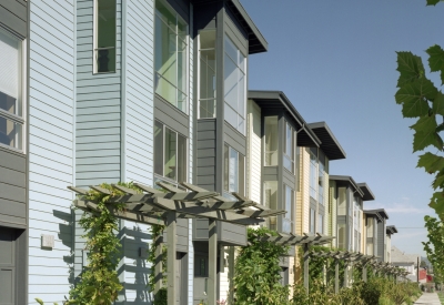 Trellis and sidewalk perspective at Magnolia Row in West Oakland, California.