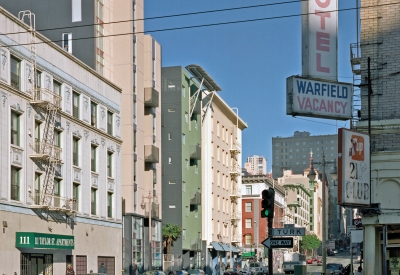 Curran House in context, seen between historic buildings. 