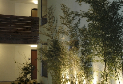 Courtyard at night at Folsom-Dore Supportive Apartments in San Francisco, California.