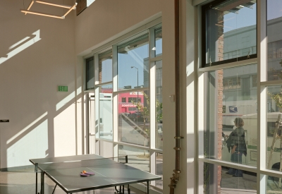 Flex space in the common area with a ping pong table at Folsom-Dore Supportive Apartments in San Francisco, California.