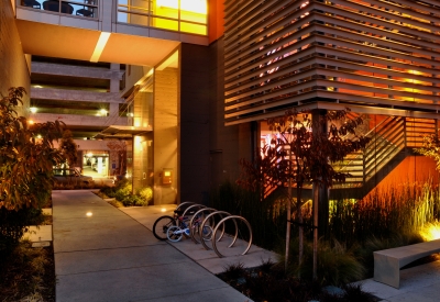 Bike parking next to stairs at 888 Seventh Street in San Francisco at night.