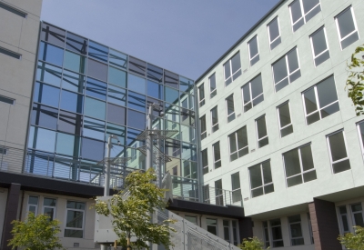 Exterior view of the glass sound wall at 888 Seventh Street in San Francisco.