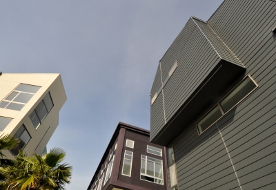 Looking up at the three different buildings at Pacific Cannery Lofts in Oakland, California.