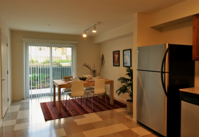 Kitchen and dining room inside a unit at Armstrong Place in San Francisco.