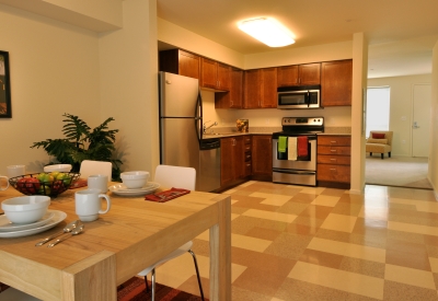Dining room and kitchen inside a unit at Armstrong Place in San Francisco.