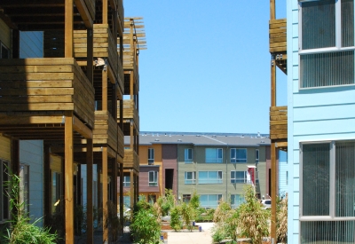 View of the townhouses through two apartment buildings at Crescent Cove in San Francisco.