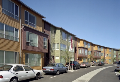Curved row of townhouses in the private street at Crescent Cove in San Francisco.