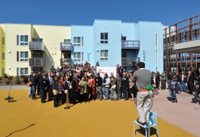 Group of people posing for a photo at Ironhorse at Central Station in Oakland, California.