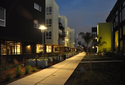 Exterior view dusk with Ironhorse at Central Station on the left and Pacific Cannery Lofts in Oakland, California.