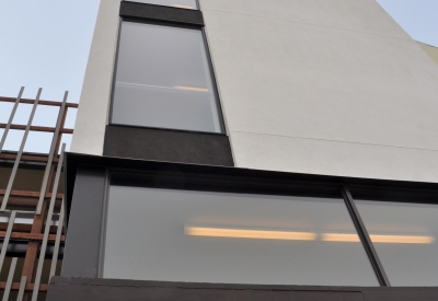 Detail view of the open-air stair tower at Ironhorse at Central Station in Oakland, California.