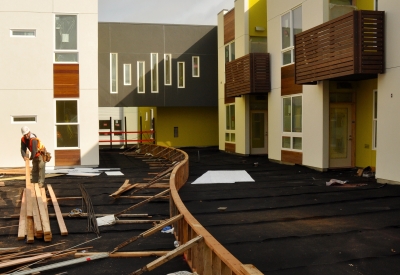 Apartment building under construction at Tassafaronga Village in East Oakland, CA.
