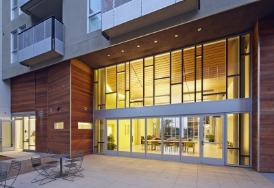 Looking into the community lounge from the courtyard at Station Center Family Housing in Union City, Ca.