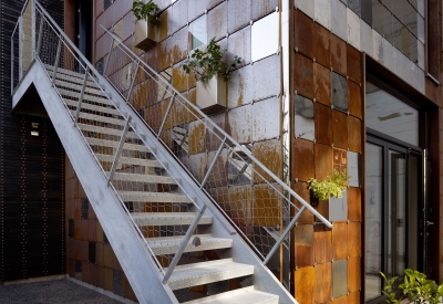 View of the outdoor metal stairs at Zero Cottage in San Francisco.