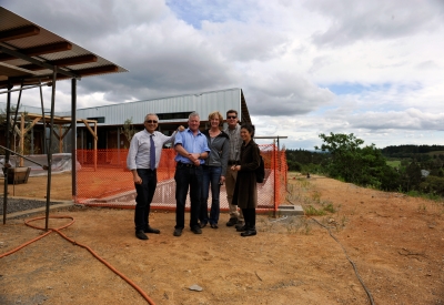 Four people standing in front of Healdsburg Rural House during construction.