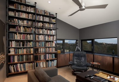 Wall to ceiling book cases in a study at Healdsburg Rural House in Healdsburg, California.