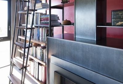 Bookcase and fireplace inside Healdsburg Rural House in Healdsburg, California.