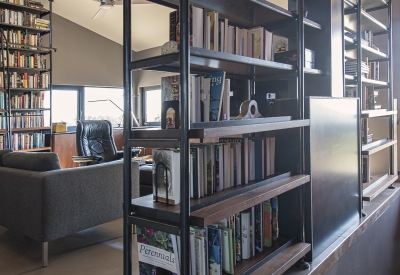 Bookshelf with downstairs showing in the corner inside Healdsburg Rural House in Healdsburg, California.