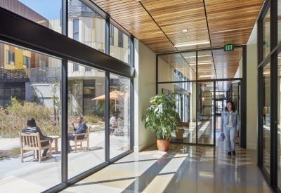 Hallway looking out into the courtyard inside Dr. George Davis Senior Building in San Francisco.