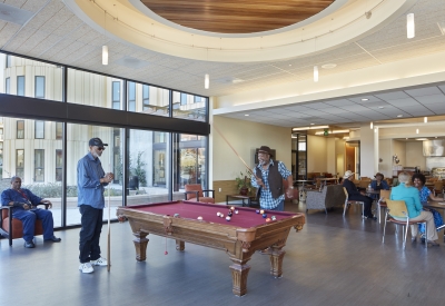 Residents playing pool at the Senior Center inside Dr. George Davis Senior Building in San Francisco.