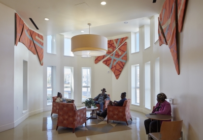 Resident sitting inside the Dr. George Davis Senior Building in San Francisco.