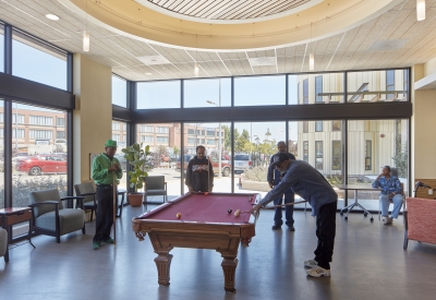 Residents playing pool at the Senior Center inside Dr. George Davis Senior Building in San Francisco.