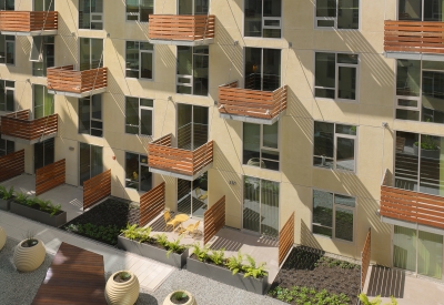 Wood balconies surrounding the courtyard at Rincon Green in San Francisco.