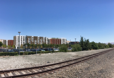 Exterior rendering of the South elevation across tracks, from Decoto Road and 12th Street at Windflower II in Union City, California.