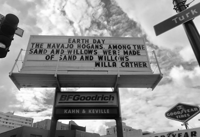 Sign at previous 555 Larkin site that states "Earth Day. The Navajo Hogans among the sand and willows were made of sand and willows. - Willa Carter"