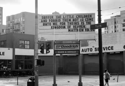 Sign at previous 555 Larkin site that states "Suffer the little children and forbid them not to come unto me for theirs is the kingdom of heaven. Matthew 19:14"