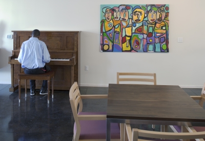 Man playing the piano at Armstrong Place Senior in San Francisco.