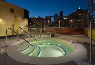 Hot tub on the roof of Rincon Green at dusk in San Francisco.